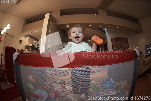 Image of cute little baby playing in mobile bed