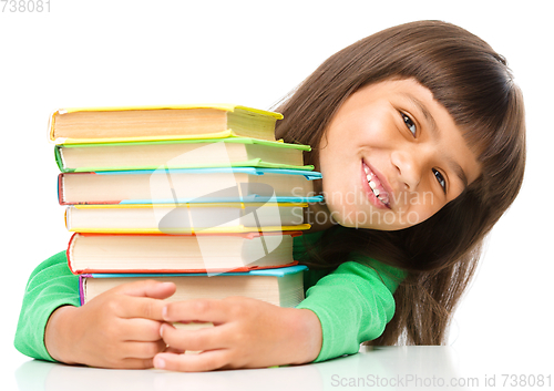 Image of Little girl with her books