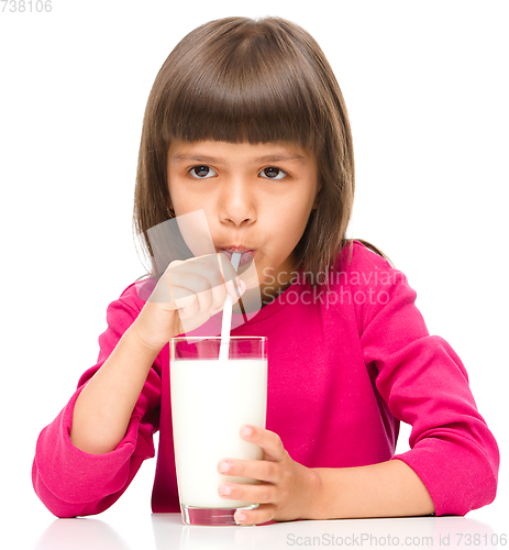 Image of Cute little girl with a glass of milk