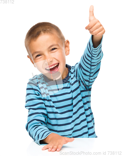 Image of Little boy is showing thumb up sign