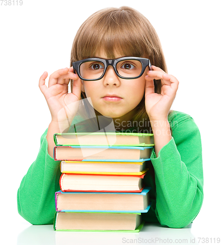 Image of Little girl is reading a book