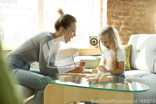 Image of Teacher and little girl, or mom and daughter. Homeschooling concept