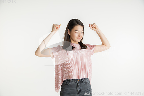 Image of Beautiful girl\'s half-length portrait on white studio background