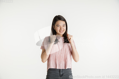 Image of Beautiful girl\'s half-length portrait on white studio background