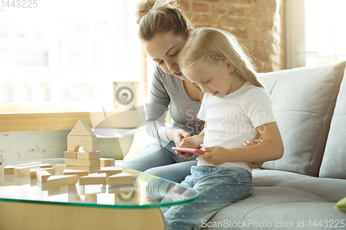 Image of Teacher and little girl, or mom and daughter. Homeschooling concept