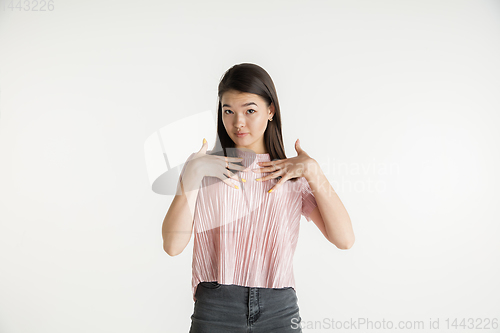 Image of Beautiful girl\'s half-length portrait on white studio background