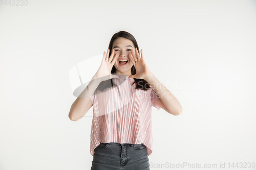 Image of Beautiful girl\'s half-length portrait on white studio background