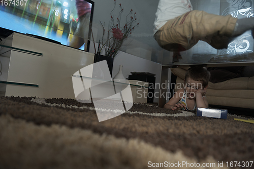 Image of Little child playing with sister at home