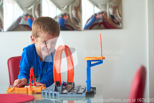 Image of Father and children playing car toy game