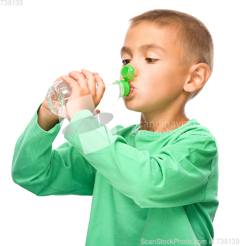 Image of Boy with plastic bottle of water