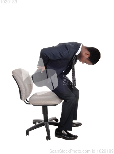 Image of Man with back pain getting up from chair