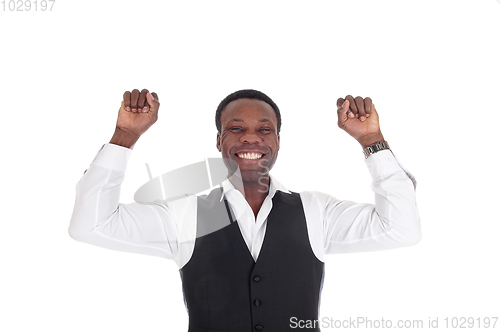 Image of Happy African man with hands raised