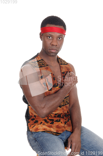 Image of Serious looking African man in a vest