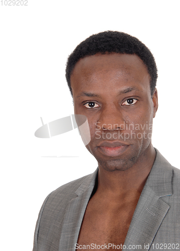 Image of African man standing in a portrait image