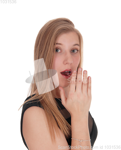 Image of Woman telling an secret behind her hand