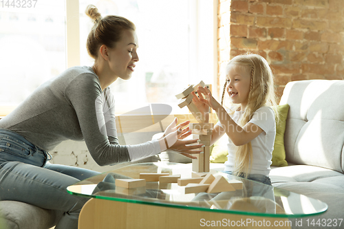 Image of Teacher and little girl, or mom and daughter. Homeschooling concept