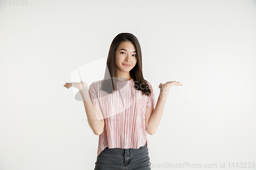 Image of Beautiful girl\'s half-length portrait on white studio background