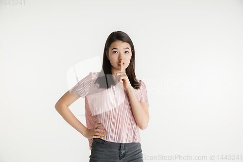 Image of Beautiful girl\'s half-length portrait on white studio background