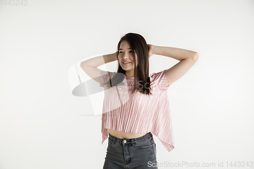 Image of Beautiful girl\'s half-length portrait on white studio background