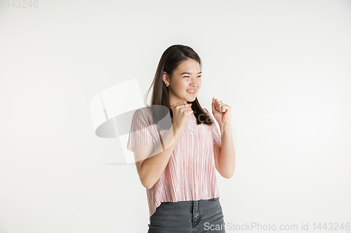 Image of Beautiful girl\'s half-length portrait on white studio background