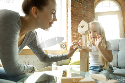 Image of Teacher and little girl, or mom and daughter. Homeschooling concept