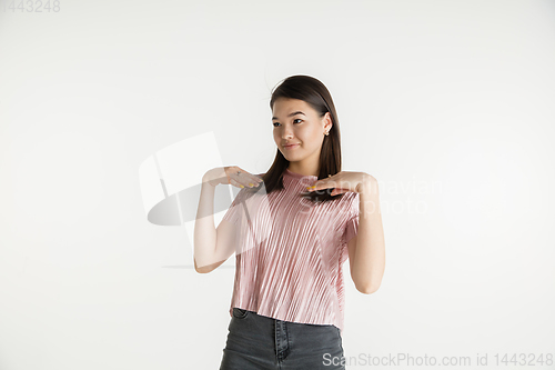 Image of Beautiful girl\'s half-length portrait on white studio background