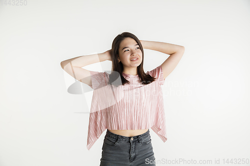 Image of Beautiful girl\'s half-length portrait on white studio background