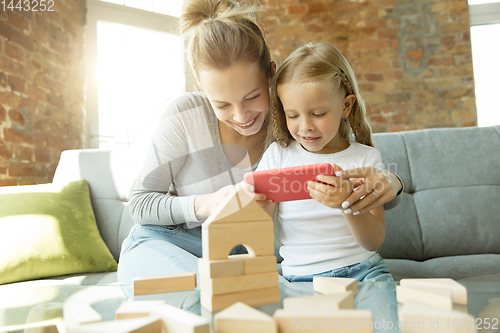 Image of Teacher and little girl, or mom and daughter. Homeschooling concept