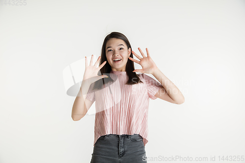 Image of Beautiful girl\'s half-length portrait on white studio background