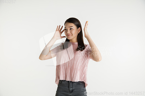 Image of Beautiful girl\'s half-length portrait on white studio background