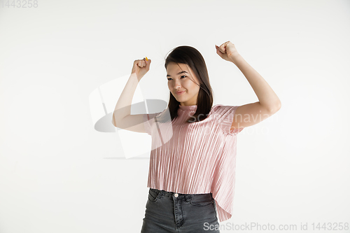 Image of Beautiful girl\'s half-length portrait on white studio background