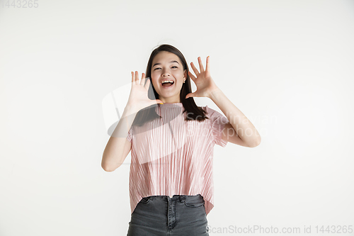 Image of Beautiful girl\'s half-length portrait on white studio background