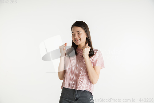 Image of Beautiful girl\'s half-length portrait on white studio background