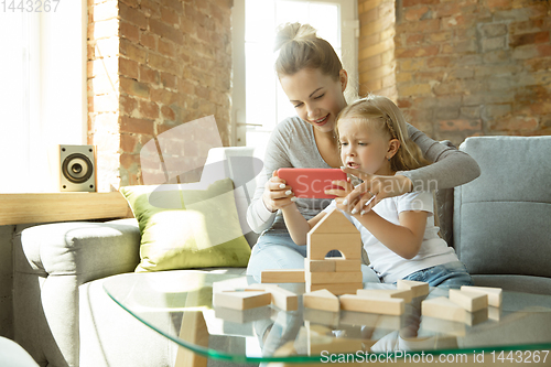 Image of Teacher and little girl, or mom and daughter. Homeschooling concept