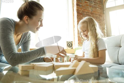 Image of Teacher and little girl, or mom and daughter. Homeschooling concept