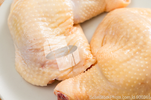 Image of Raw chicken legs on dish