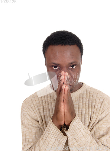 Image of Praying African man in a portrait image