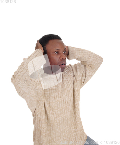 Image of Upset African man with hands on head