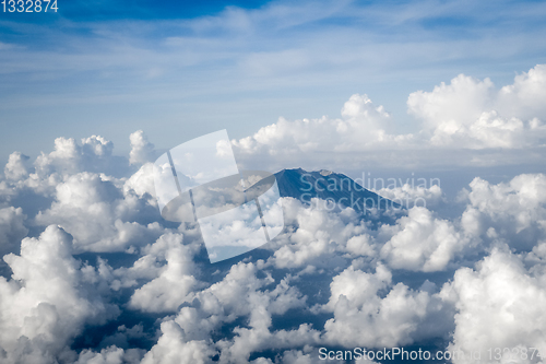 Image of Airplane flying above Mount Agung volcano, Bali, Indonesia