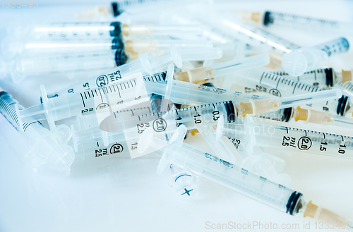 Image of Syringes on blue background