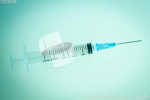 Image of Syringe on blue background