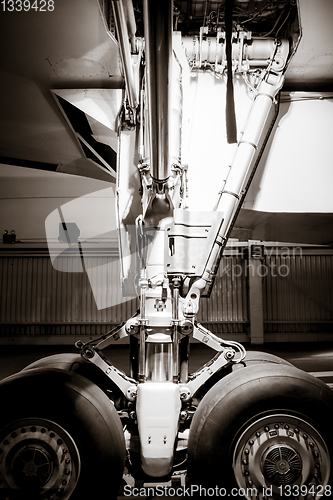 Image of Airplane landing gear detail. Black and white photo