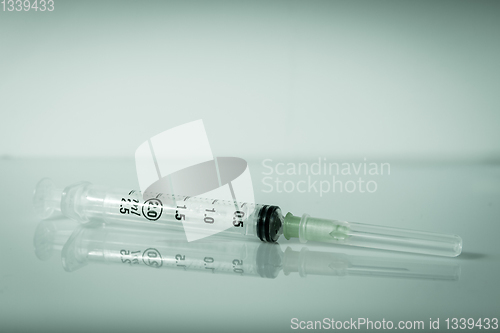 Image of Syringe on grey background