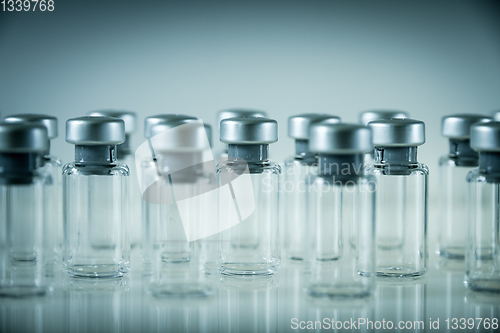 Image of Vaccine glass bottles on grey background