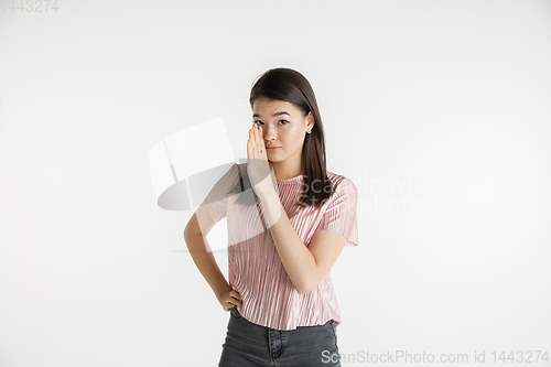 Image of Beautiful girl\'s half-length portrait on white studio background