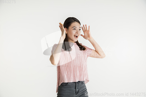 Image of Beautiful girl\'s half-length portrait on white studio background