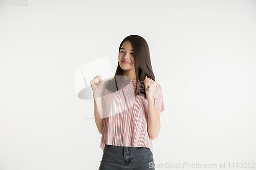 Image of Beautiful girl\'s half-length portrait on white studio background