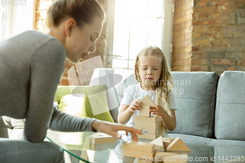 Image of Teacher and little girl, or mom and daughter. Homeschooling concept