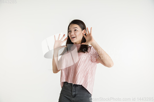 Image of Beautiful girl\'s half-length portrait on white studio background