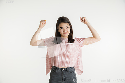 Image of Beautiful girl\'s half-length portrait on white studio background